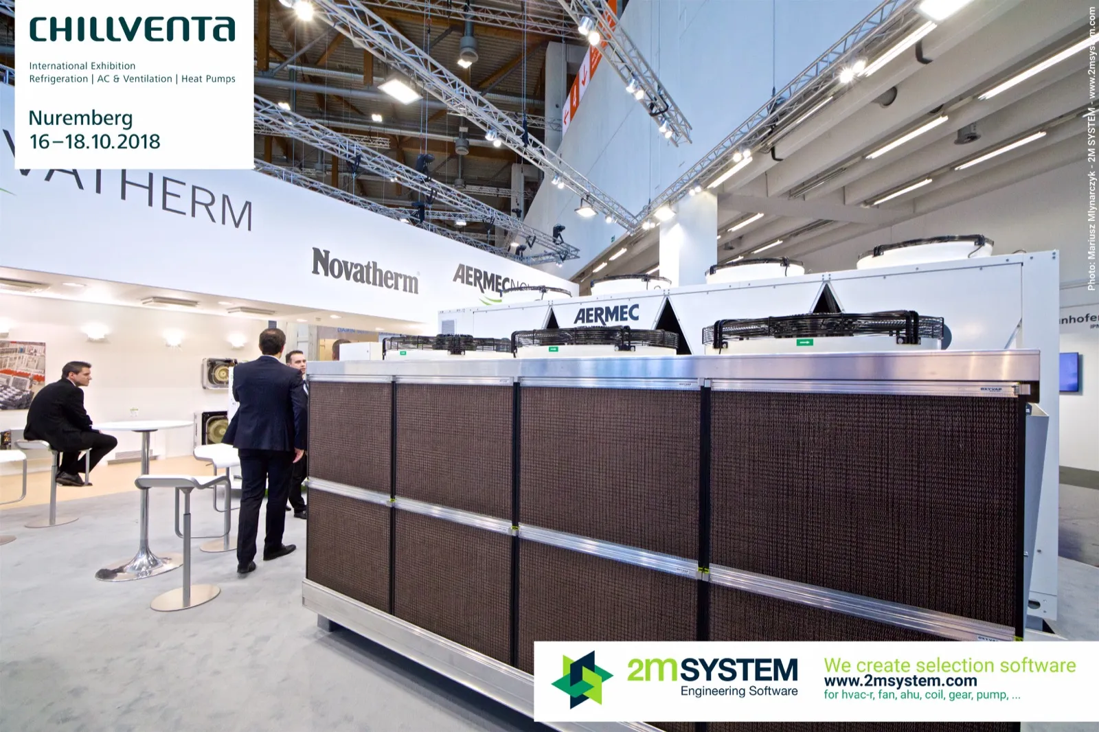 Adiabatic dry cooler with brown pre-cooling pads in front of an Aermec chiller at Chillventa 2018