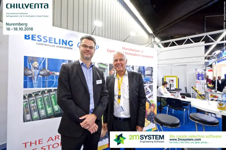 Besseling Group representatives beside green-lit control module photos