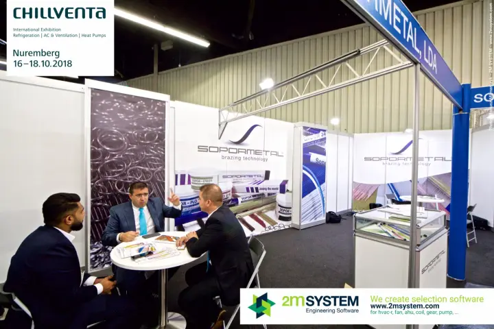 Business meeting at the Sopormetal stand beside silver brazing alloy graphics