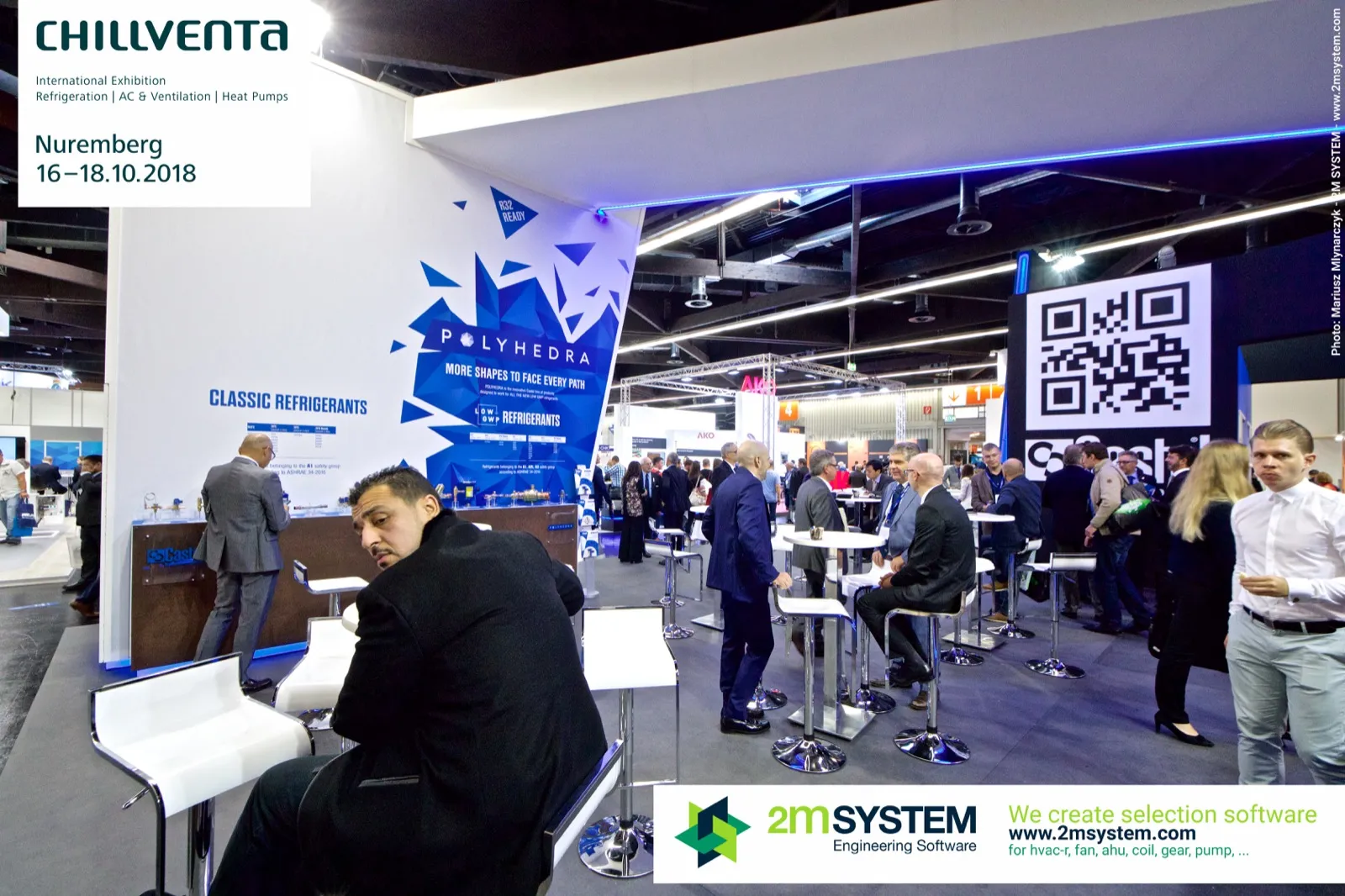 Castel Polyhedra wall and crowded meeting area with white bar stools at Chillventa 2018