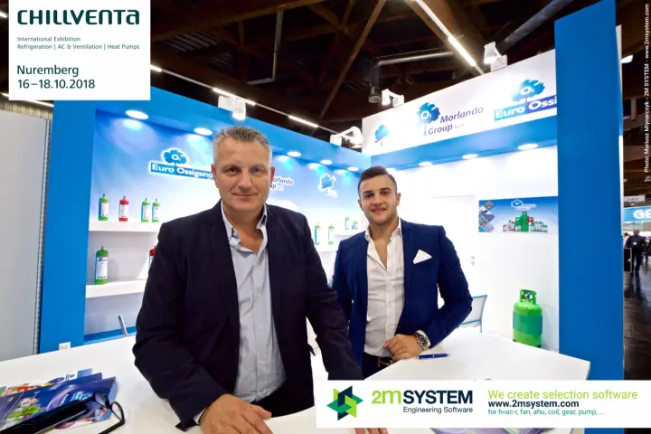 Closer portrait at the Morlando Group stand with refrigerant cans behind