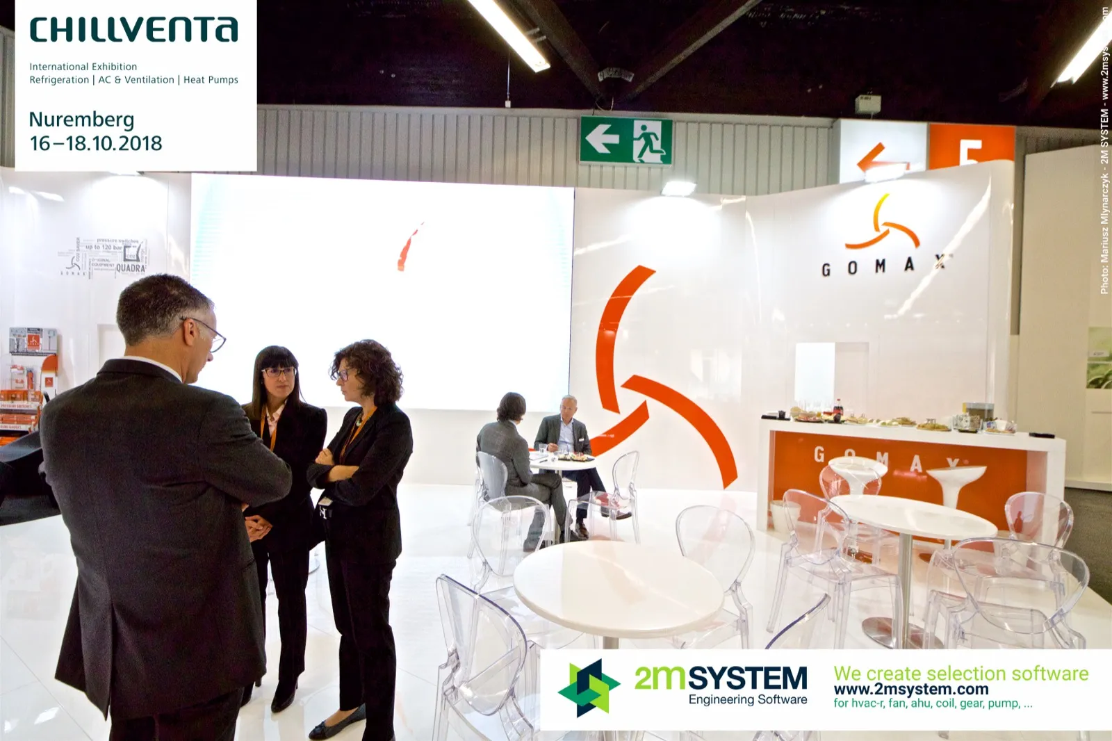 Conversations in the white Gomax meeting area beside the bar at Chillventa 2018