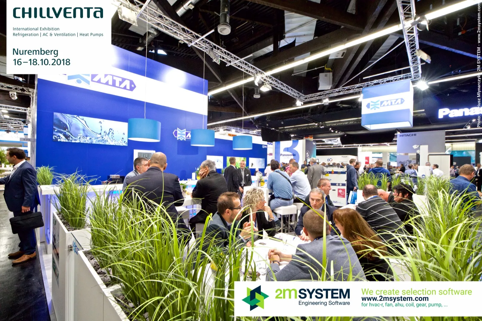 Crowded MTA stand with planters and blue pendant lamps at Chillventa 2018