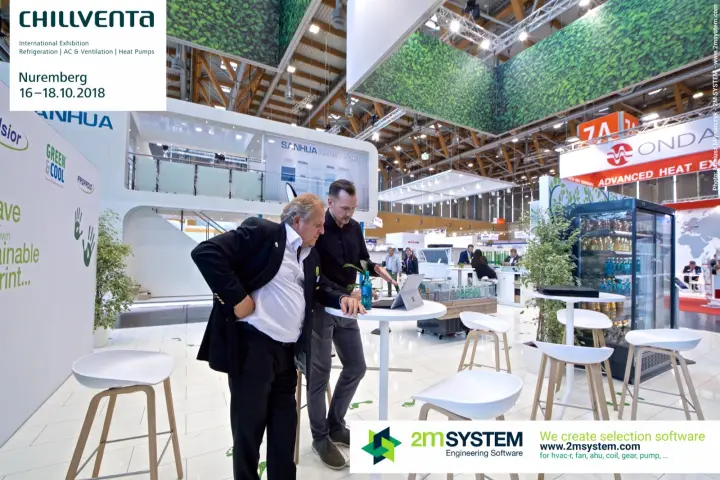 Exhibitors reviewing a laptop under the leaf canopies of Green & Cool at Chillventa 2018