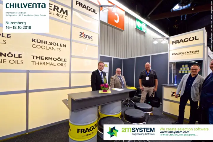 Fragol stand team at a counter built on yellow-labelled drums at Chillventa 2018