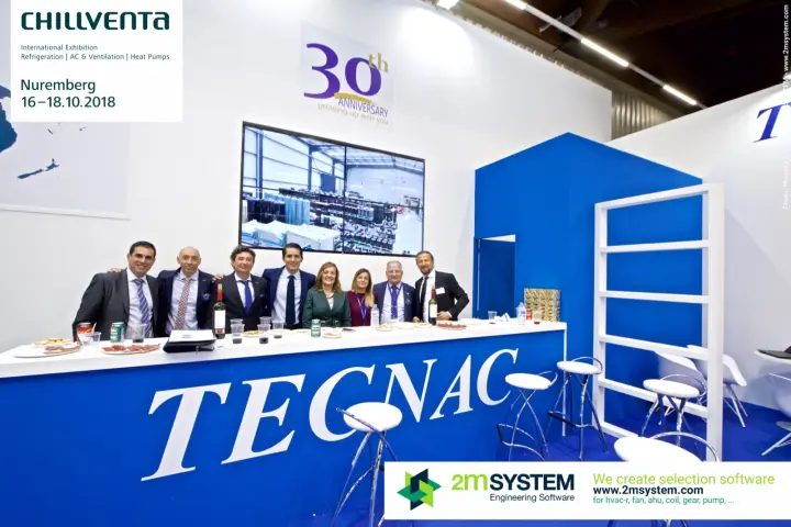 Full Tecnac team at the blue bar with the large company lettering
