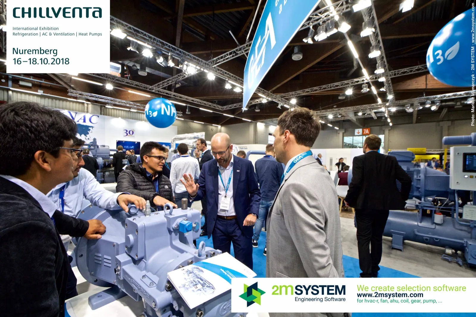 GEA staff explaining a light blue compressor to a group of visitors at Chillventa 2018