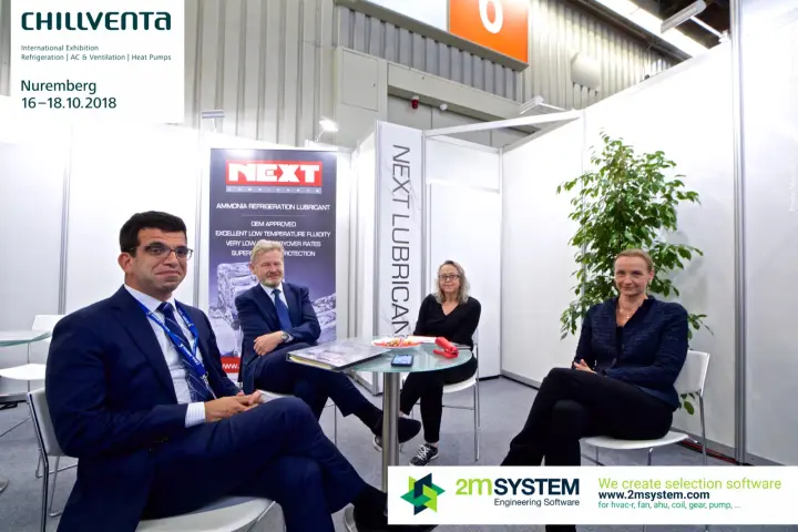 Group portrait at NEXT Lubricants with ammonia lubricant banner at Chillventa 2018