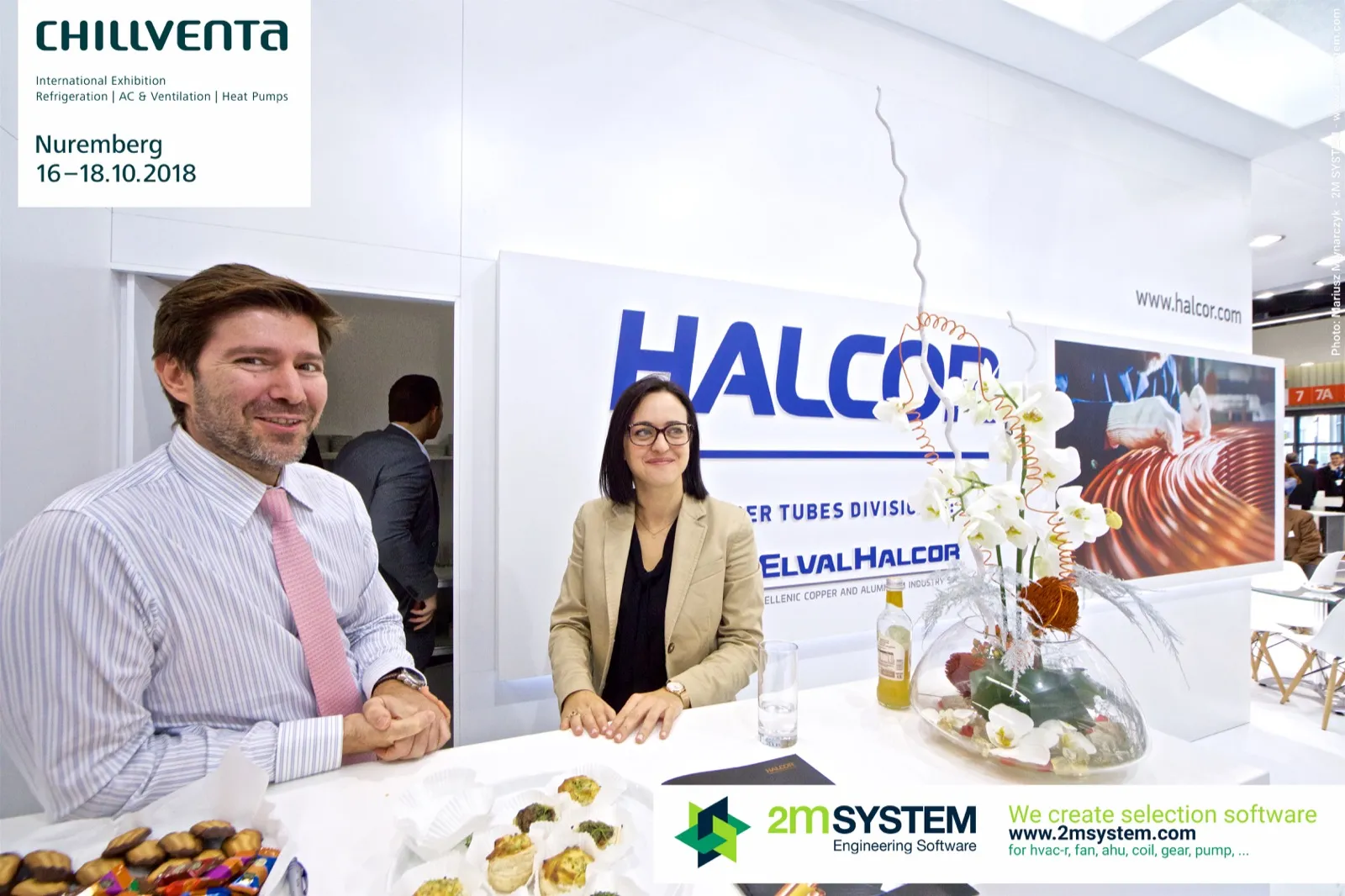 Halcor staff at the reception counter with orchid arrangement at Chillventa 2018