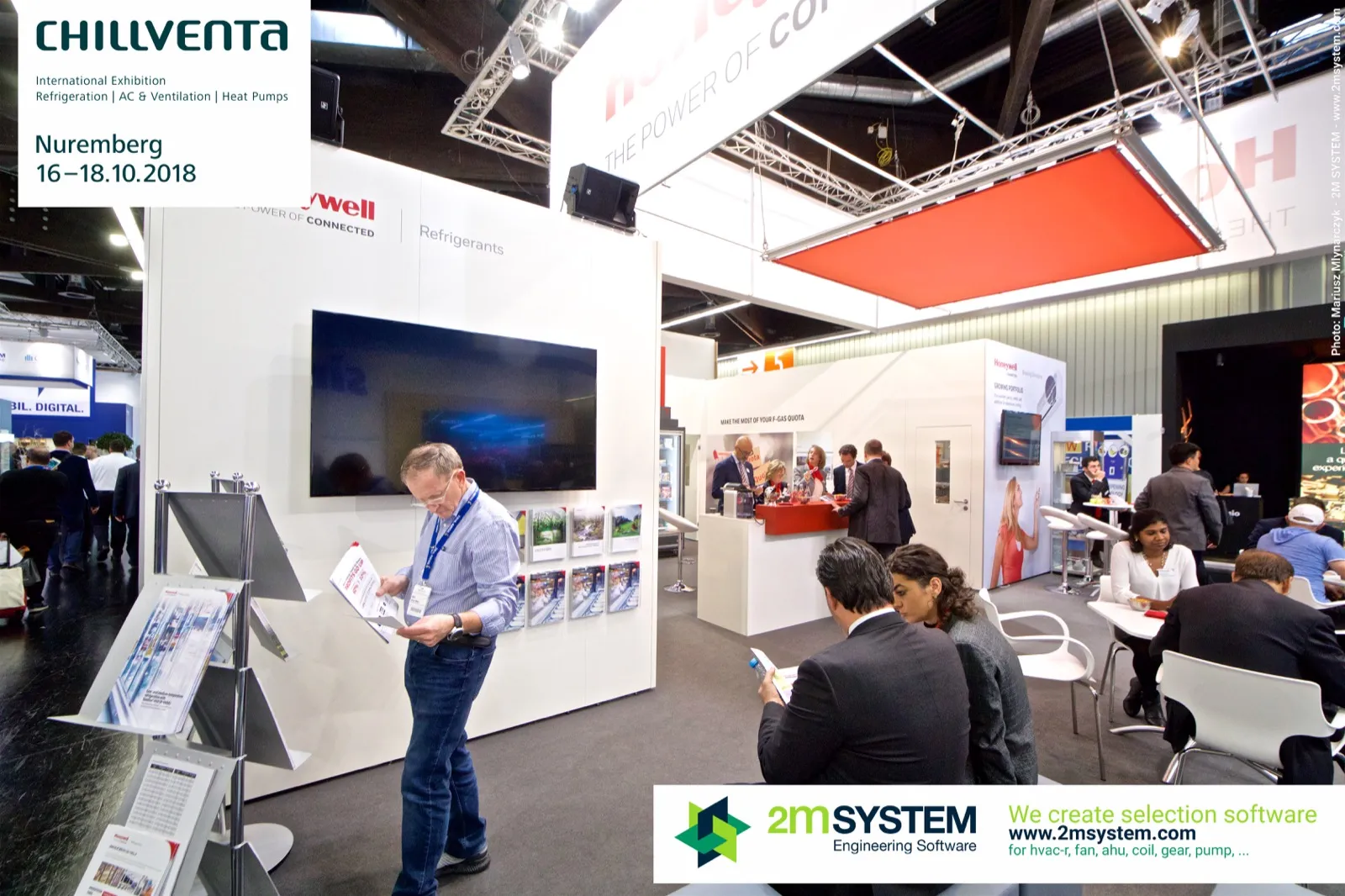 Honeywell brochure rack and refrigerants wall with visitors reading at Chillventa 2018