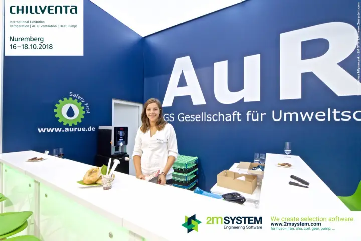 Hostess at the AuRü bar counter with coffee machine and pretzels at Chillventa 2018