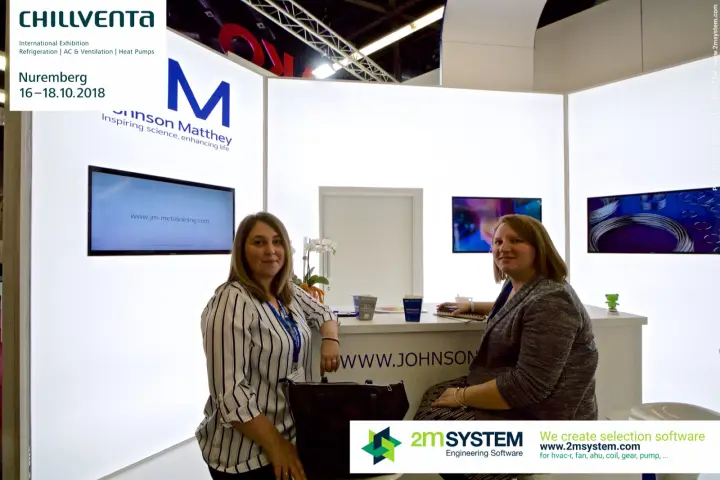 Johnson Matthey team at the white backlit stand