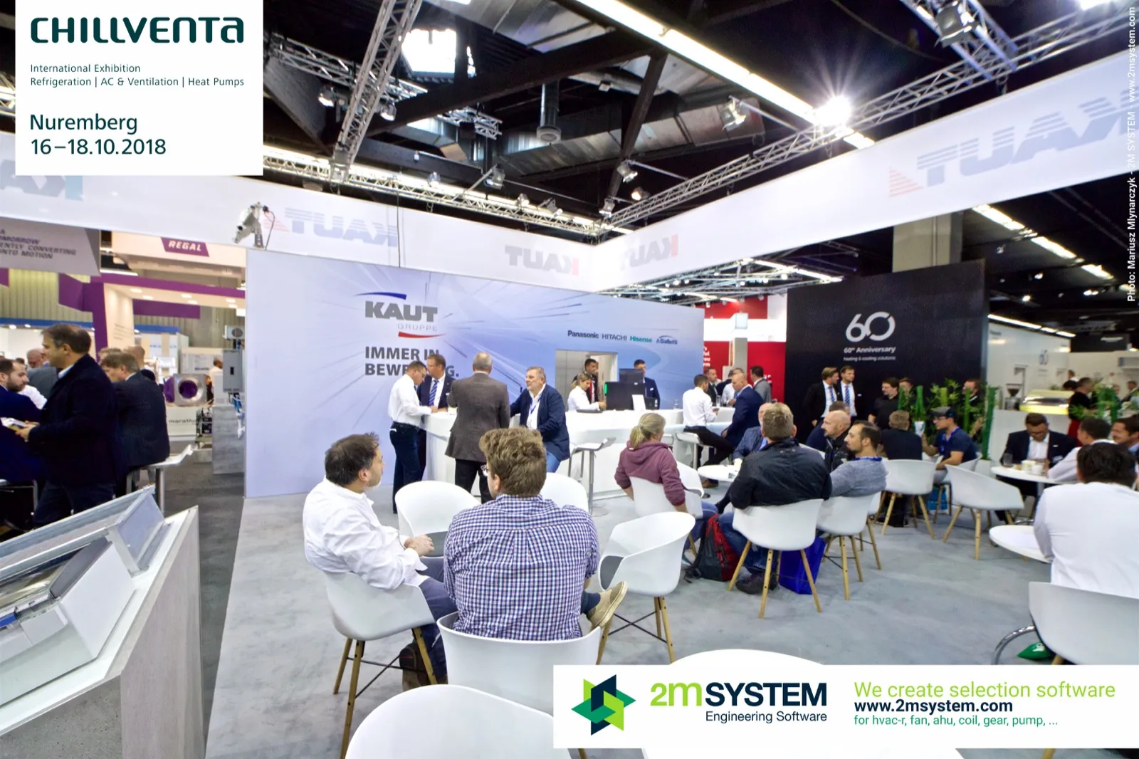 Kaut lounge with white chairs and "IMMER IN BEWEGUNG" back wall at Chillventa 2018
