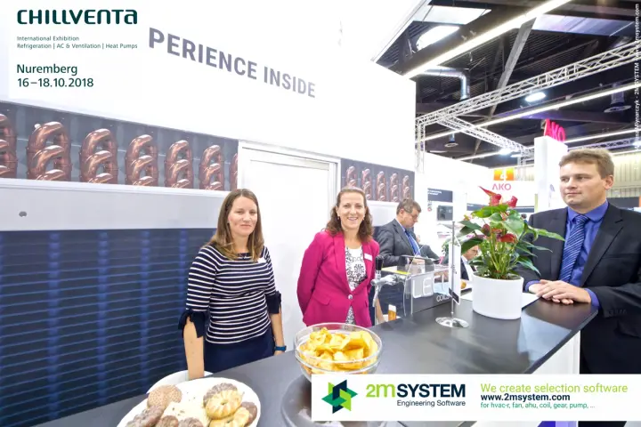 LEEL Coils team at the bar under the Experience Inside wall