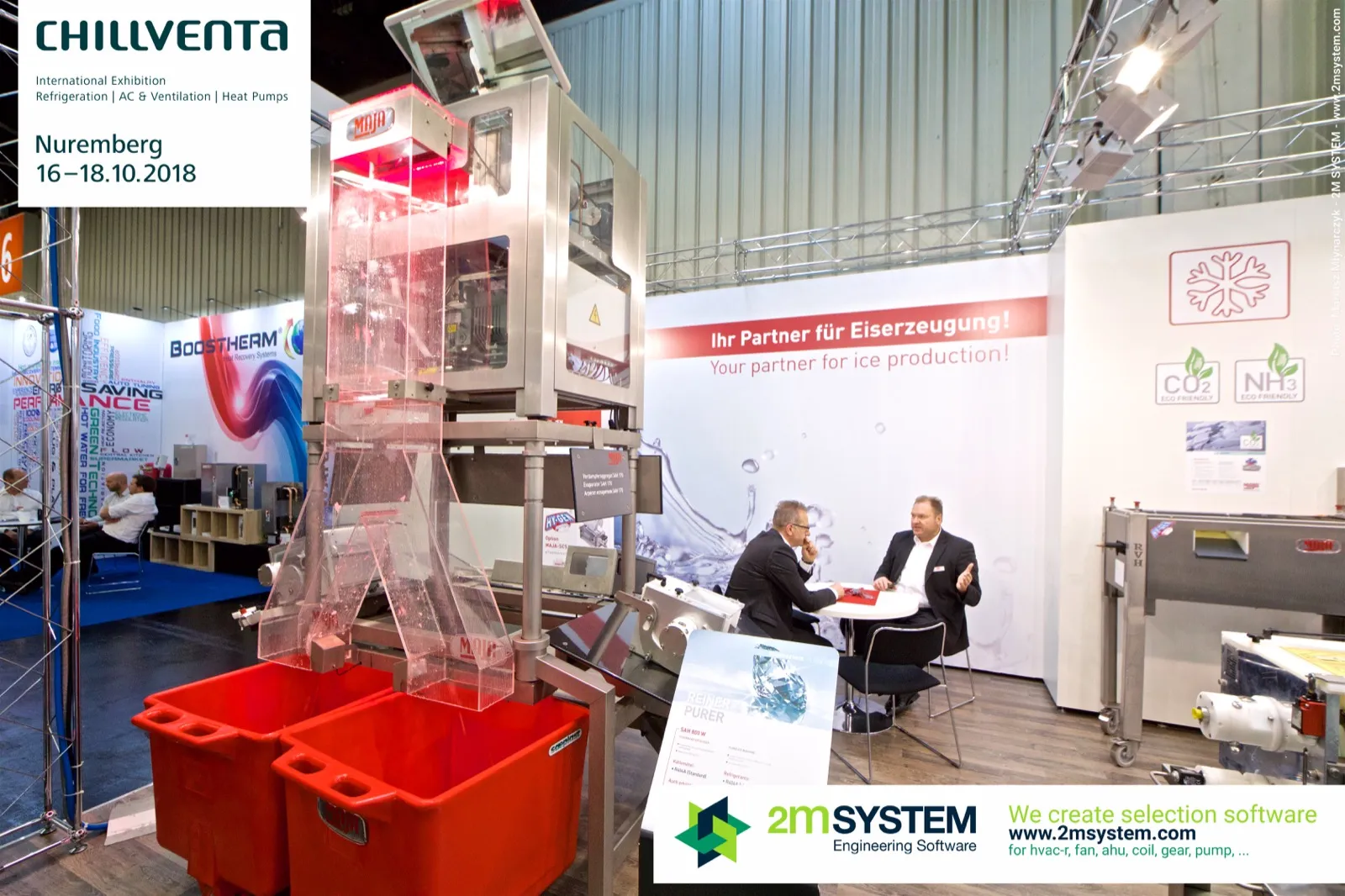 MAJA ice machine with clear chutes feeding red ice bins at Chillventa 2018
