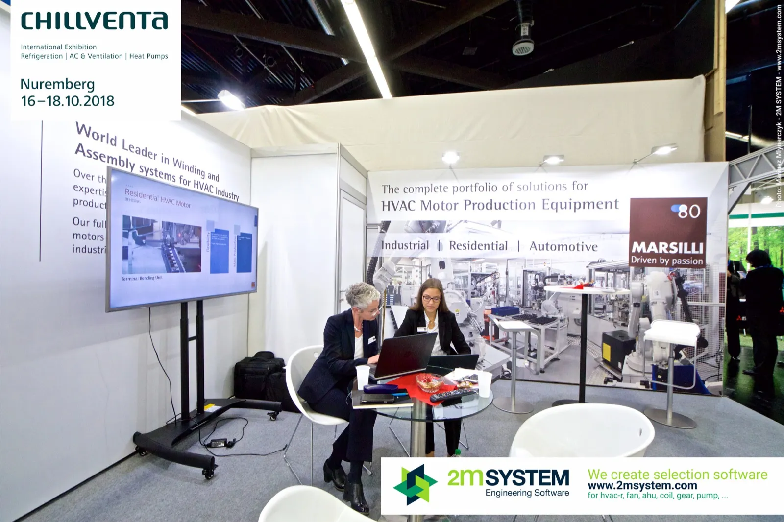 Marsilli staff at work beside a motor winding line screen at Chillventa 2018
