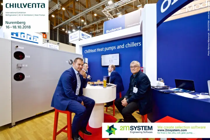Meeting at the Oilon ChillHeat stand beside a large grey unit