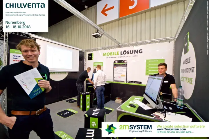mfr team member holding a brochure in front of the mobile service software stand