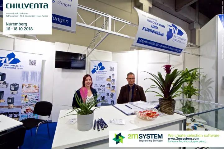MV Automation Systems reception desk with plants and roll-up banners