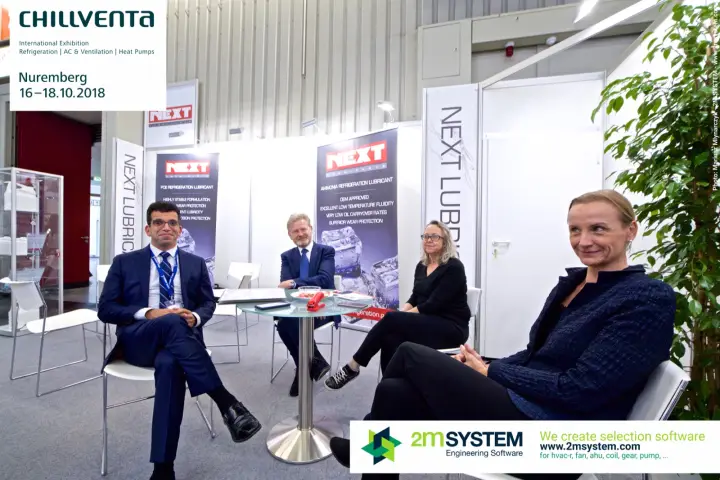 NEXT Lubricants team seated in the stand's meeting area at Chillventa 2018