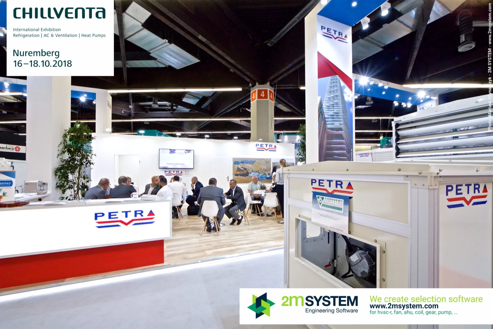 Petra meeting area busy with talks behind an illuminated counter at Chillventa 2018