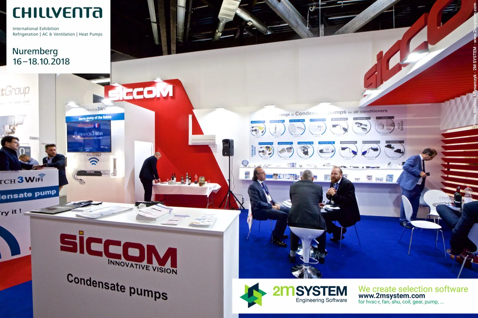 Siccom "Condensate pumps" counter and meeting tables on blue carpet at Chillventa 2018