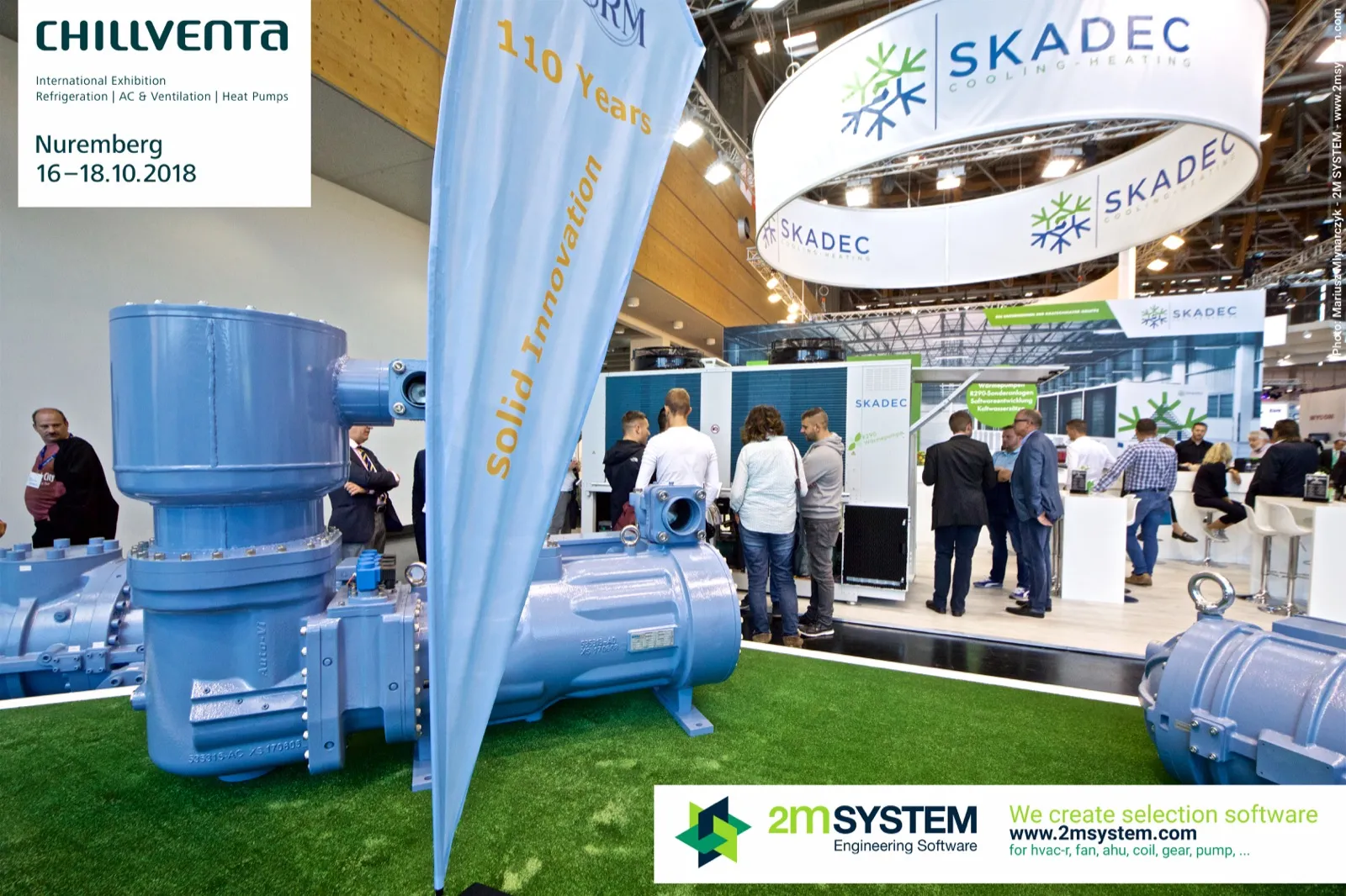 SRM screw compressor and "Solid Innovation" flag facing the busy Skadec stand at Chillventa 2018