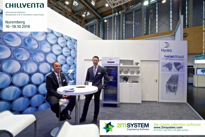 Staff at a meeting table on the Hydro and Lucas-Milhaupt stand at Chillventa 2018