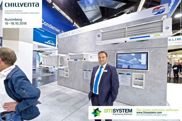 Staff member beside Güntner compact unit coolers and product screen at Chillventa 2018