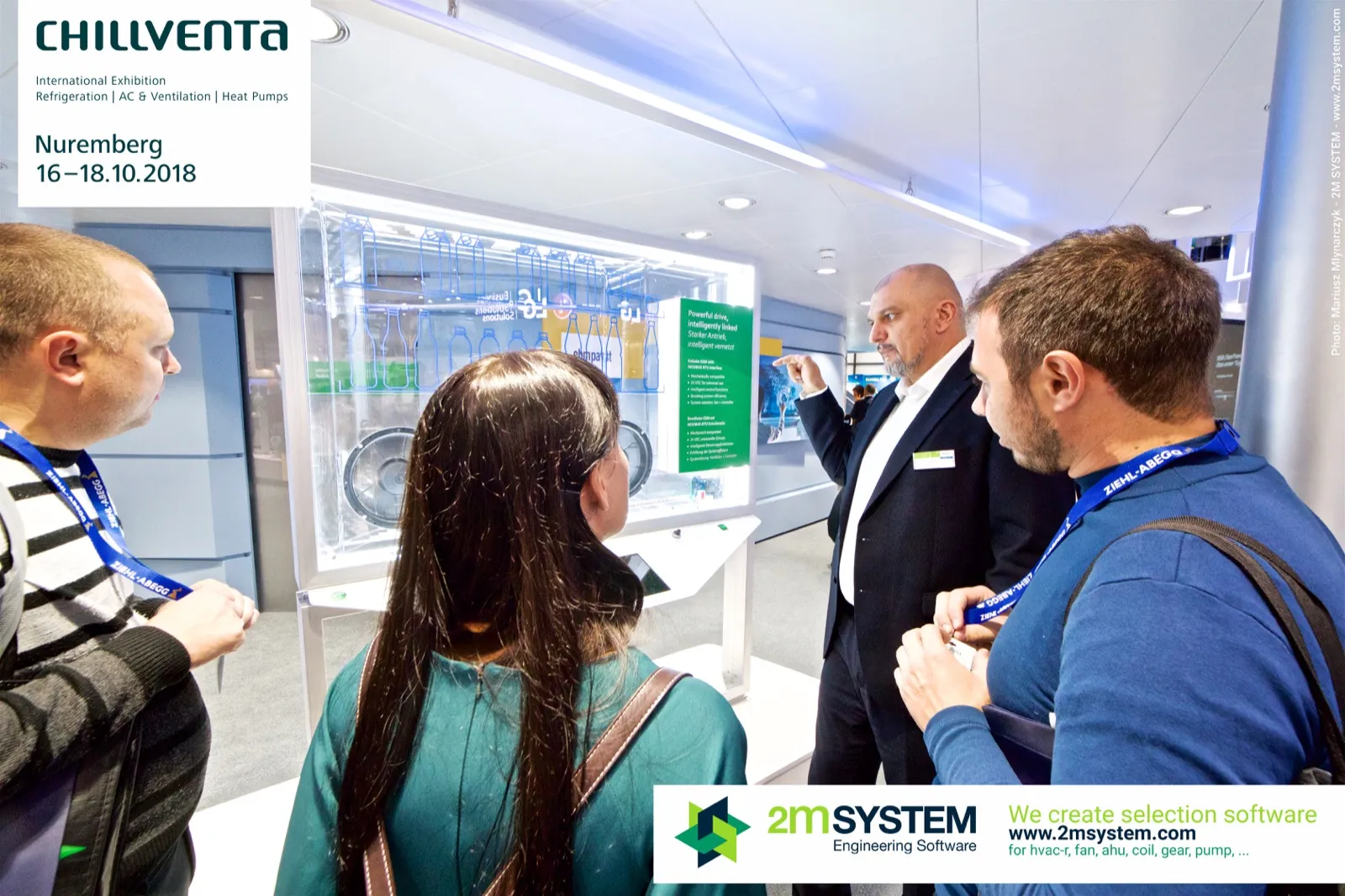 Staff member presenting a refrigerated display cabinet model with fans at Chillventa 2018