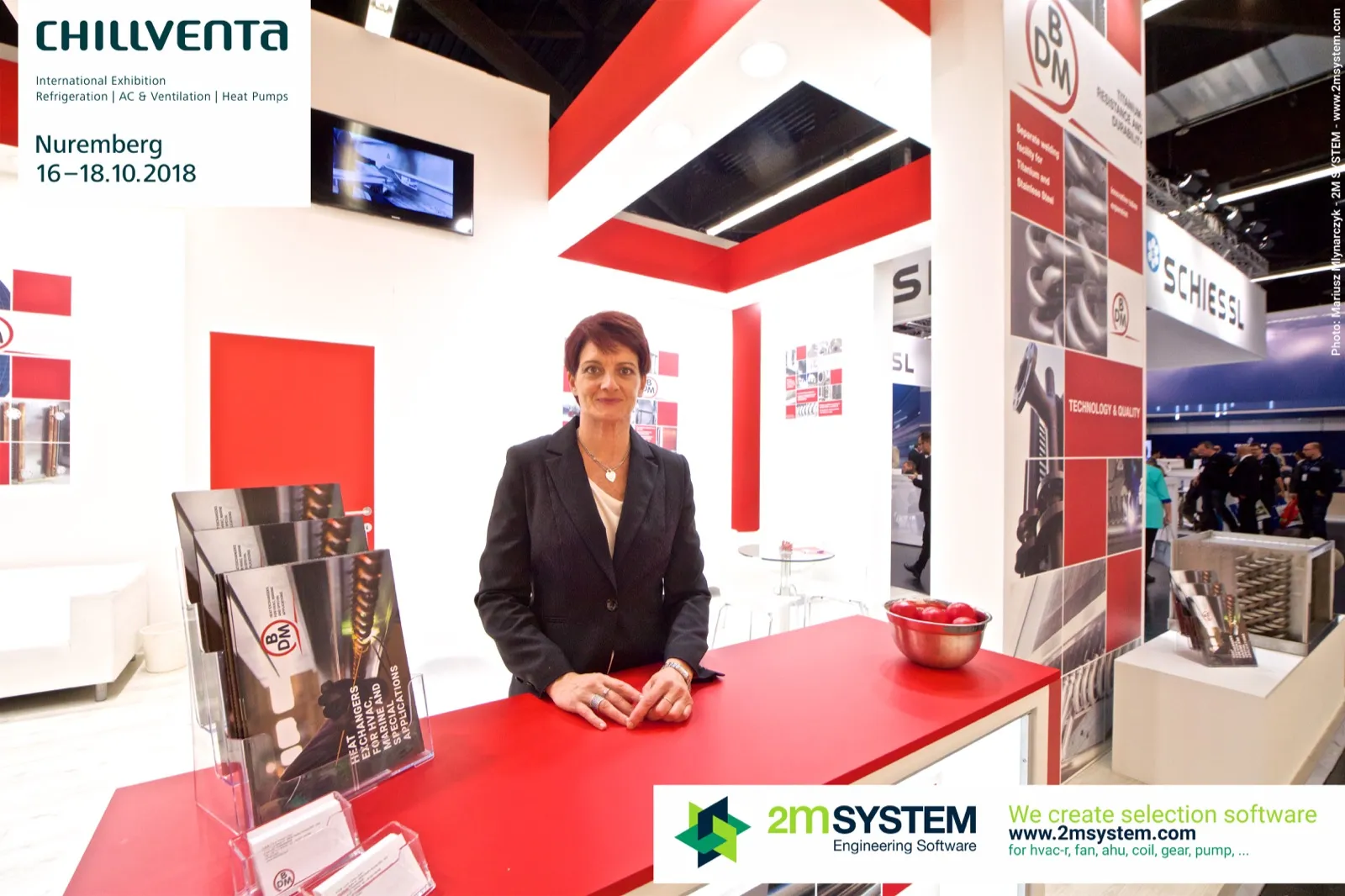 Staff at the red BDM counter with heat exchanger brochures at Chillventa 2018