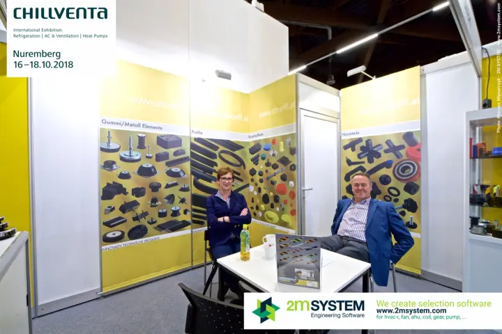 Stoeffl team at a table in front of yellow product panels
