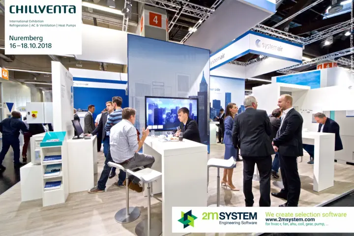 Systemair meeting tables in front of a city-skyline screen