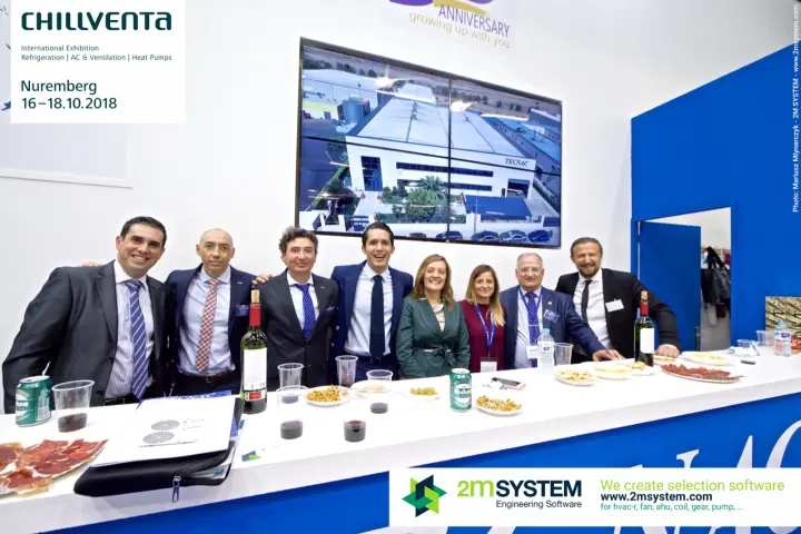 Tecnac team close-up with the factory building on screen