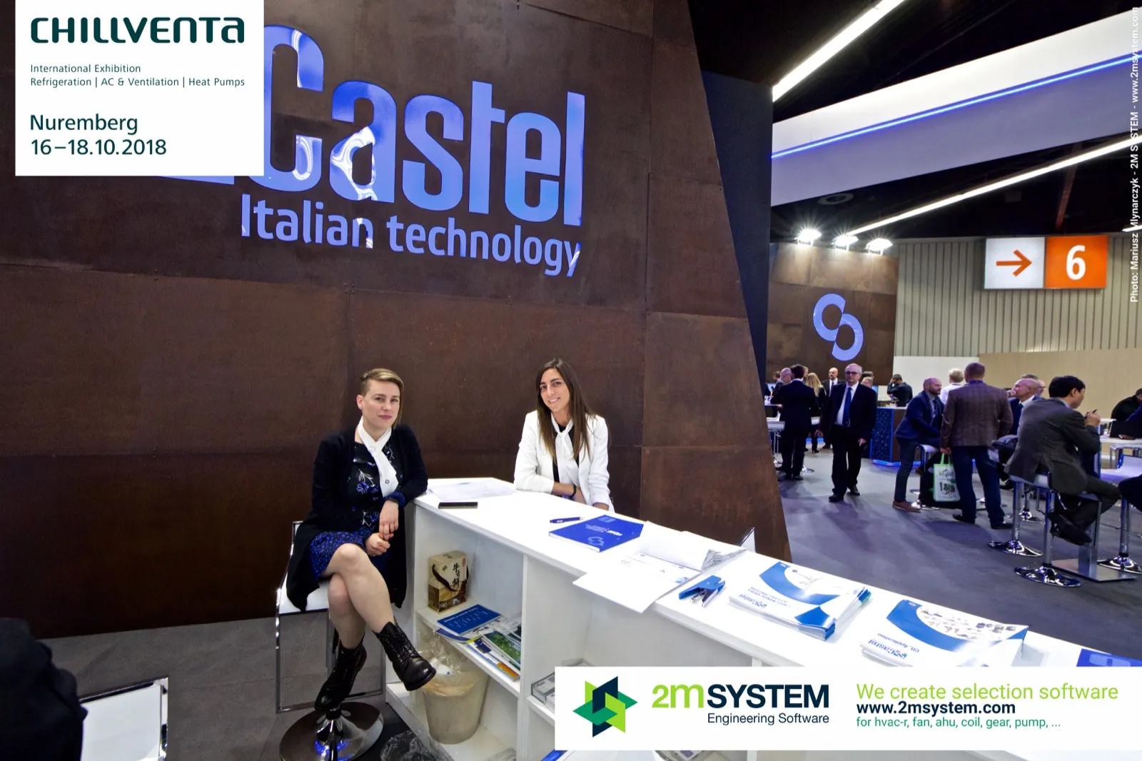 Two Castel staff at the reception desk beneath the brand lettering at Chillventa 2018