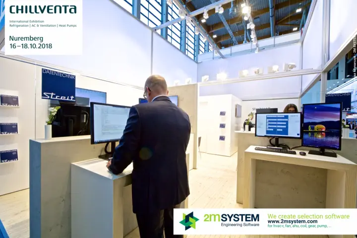 Visitor testing software at a monitor desk on the Streit Datentechnik stand