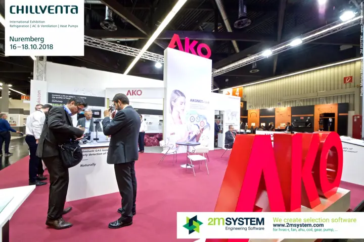 Visitors at AKO gas leak detection counter by red logo letters