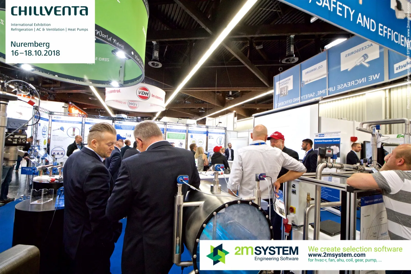 Visitors around HB Products sensor test rigs and sight-glass vessel at Chillventa 2018