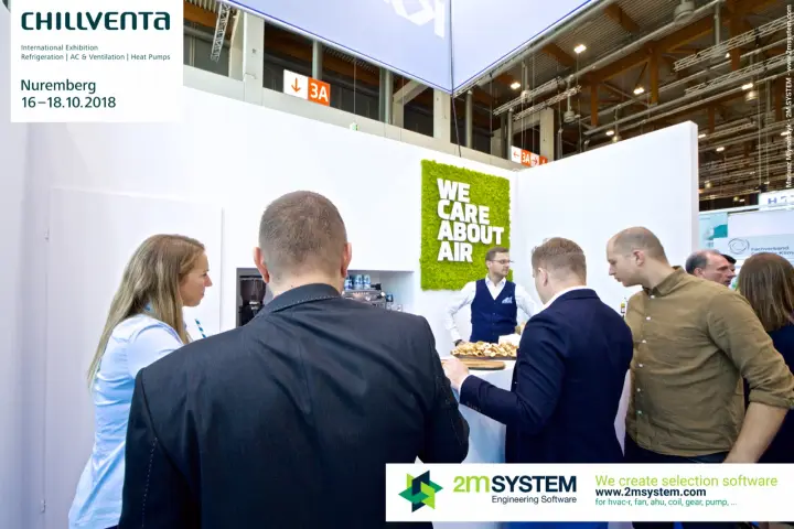 Visitors at the bar beneath a "We care about air" moss panel at Chillventa 2018