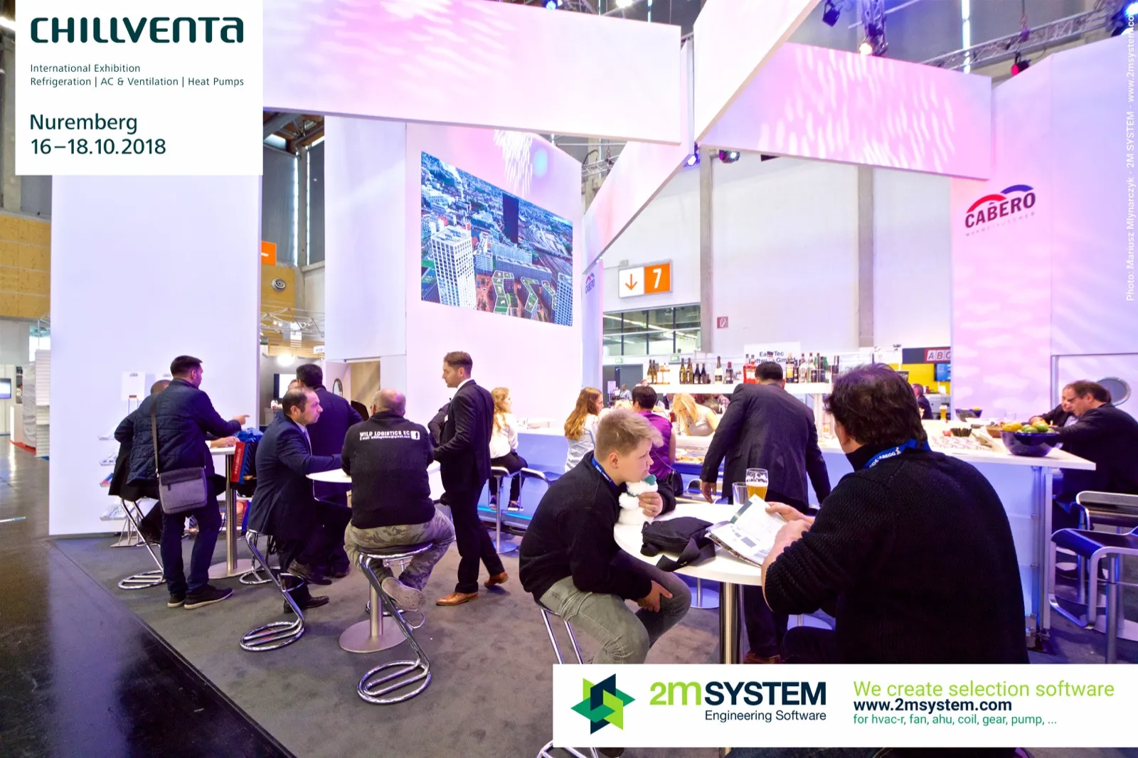 Visitors at the bar and high tables inside the Cabero stand at Chillventa 2018