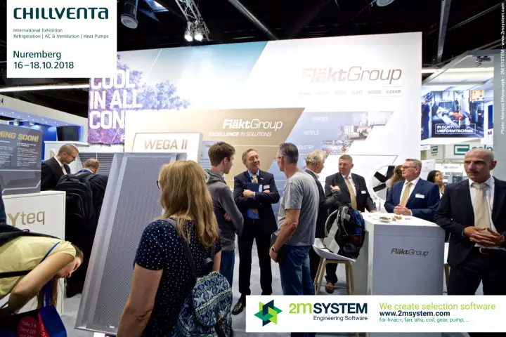 Visitors in conversation on the busy FläktGroup stand