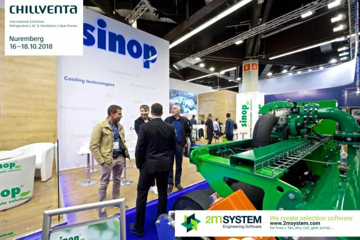 Visitors in conversation at the Sinop stand beside a green unit at Chillventa 2018