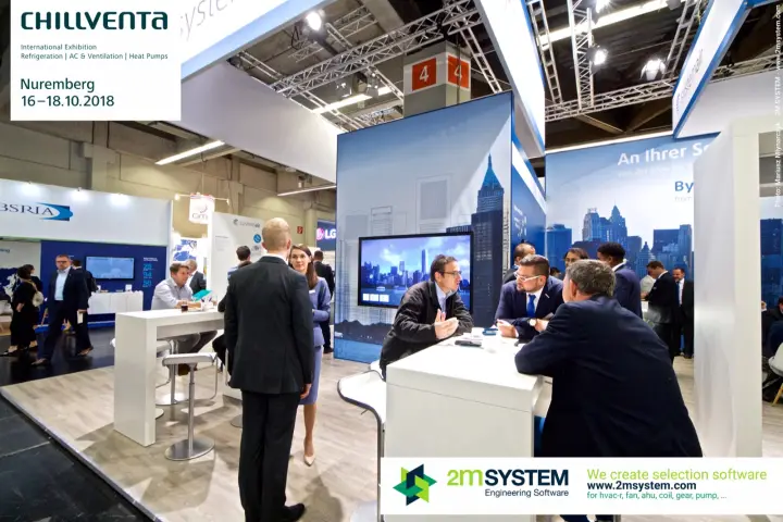 Visitors in discussion at Systemair high tables under skyline graphics