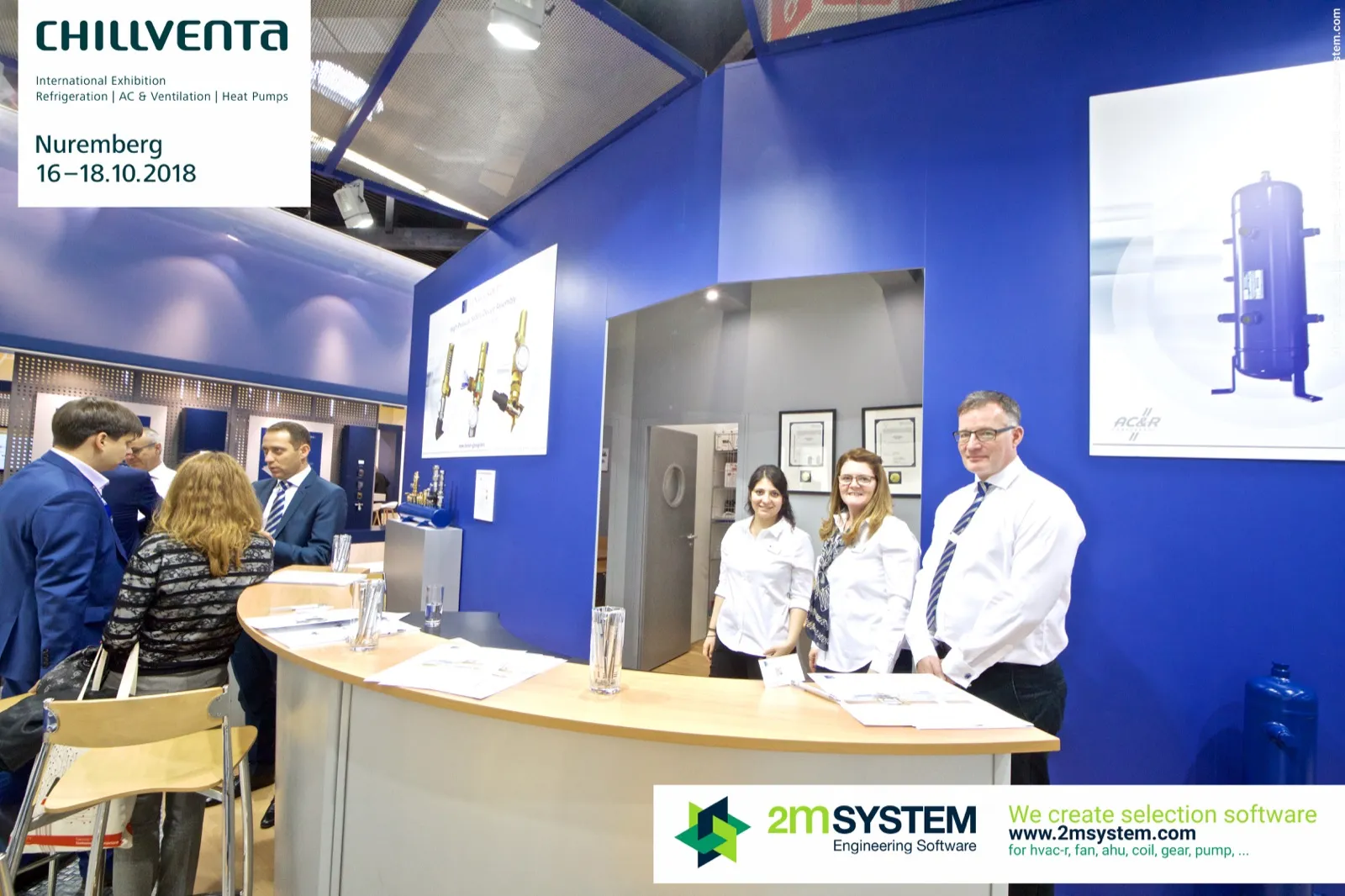 Visitors at the Henry Group counter beside a poster of an oil receiver at Chillventa 2018