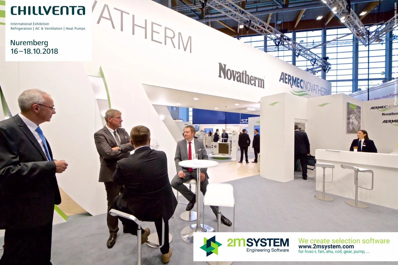 Visitors at a high table and reception desk of Aermec Novatherm at Chillventa 2018