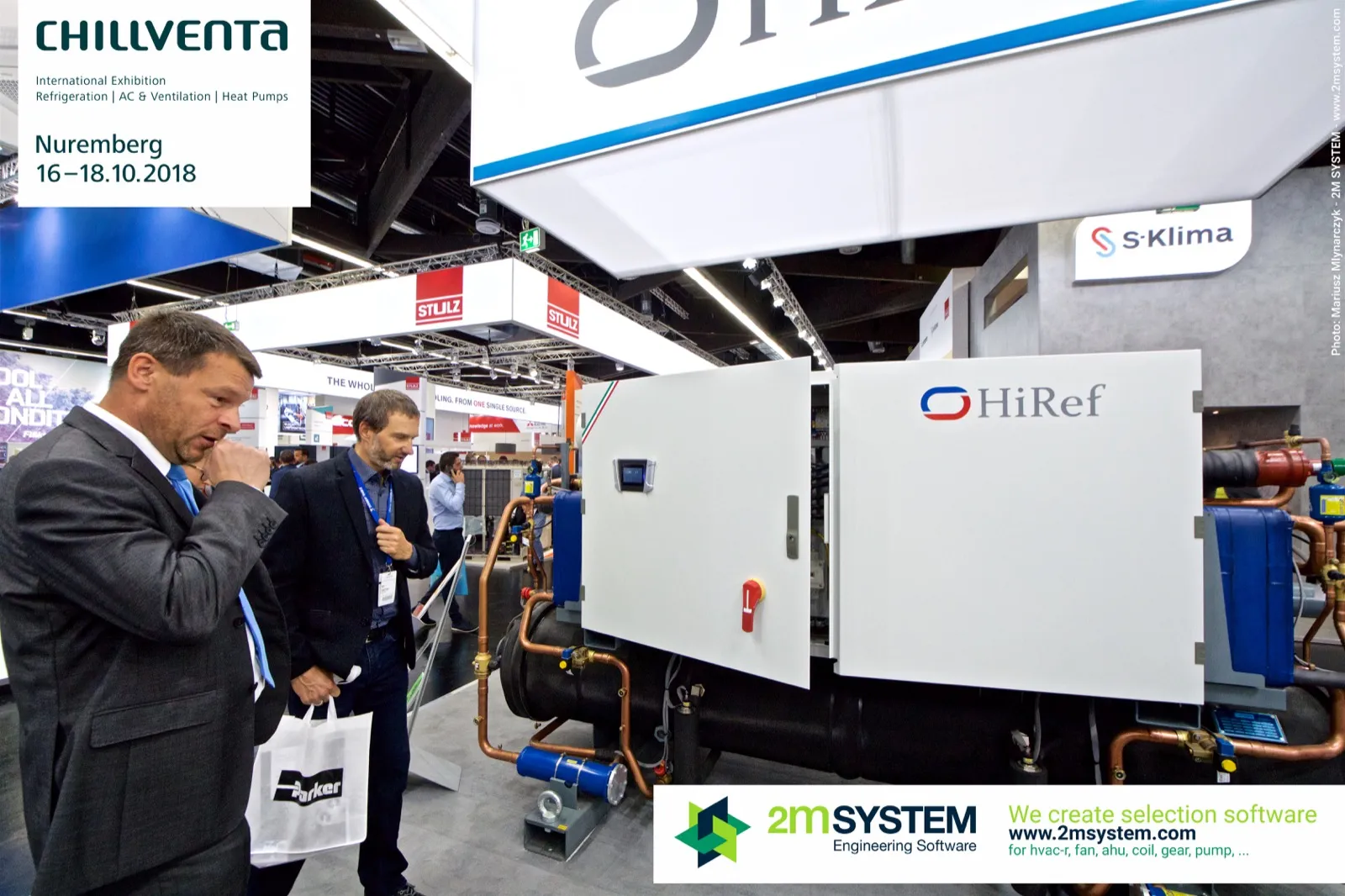 Visitors inspecting a HiRef chiller with an open cabinet door at Chillventa 2018