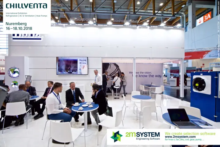 Visitors meeting at Hidria tables, screen showing oscilloscope traces