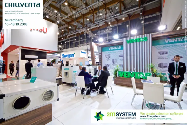 Visitors in a meeting at the Ventas stand, with a heat recovery unit in front