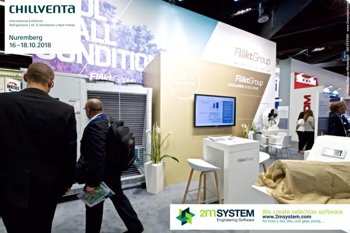 Visitors pass the FläktGroup chiller and "Excellence in Solutions" wall