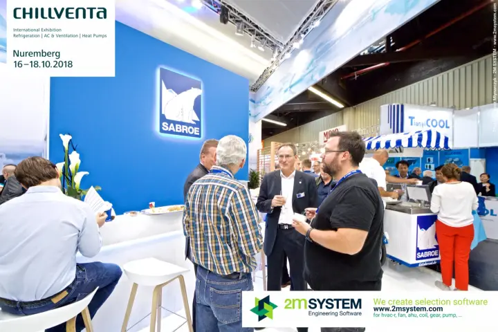 Visitors at the Sabroe lounge bar beneath the backlit polar-bear logo at Chillventa 2018